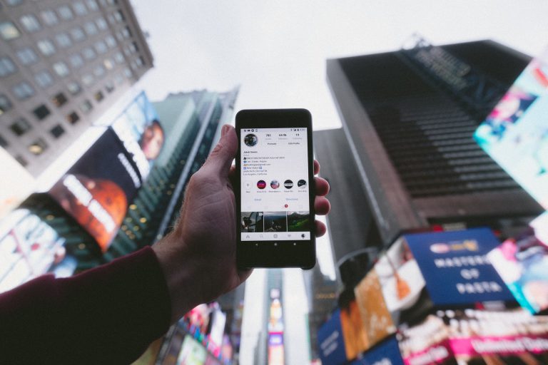 man holding up phone